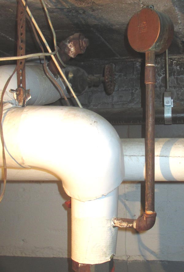 A main vent is installed on the side of a drip leg Building America